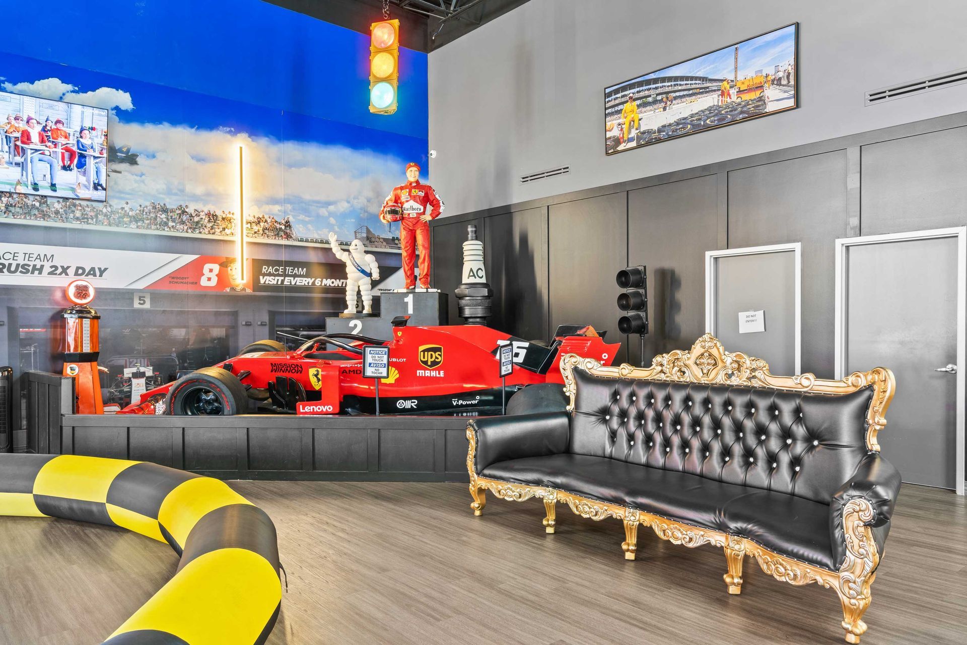 Grand Prix Dental in Katy, TX A living room with a couch and a race car on the wall.