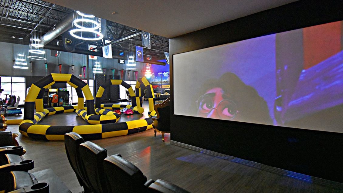 Grand Prix Dental in Katy, TX There is a large screen in the middle of the room.