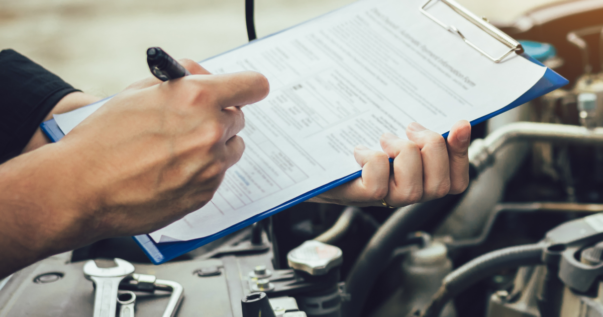 Mechanic inspecting vehicle before back-to-school driving in Lawrence KS | GenAuto