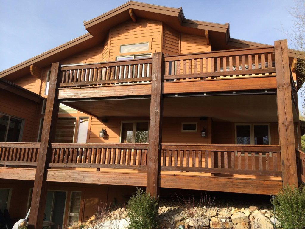 a large wooden house with a lot of balconies