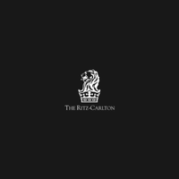 The Ritz-Carlton logo in white on a dark background
