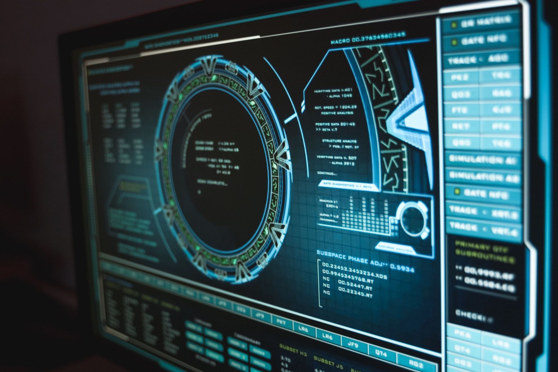 Futuristic computer dashboard with glowing blue and cyan data panels on a dark screen