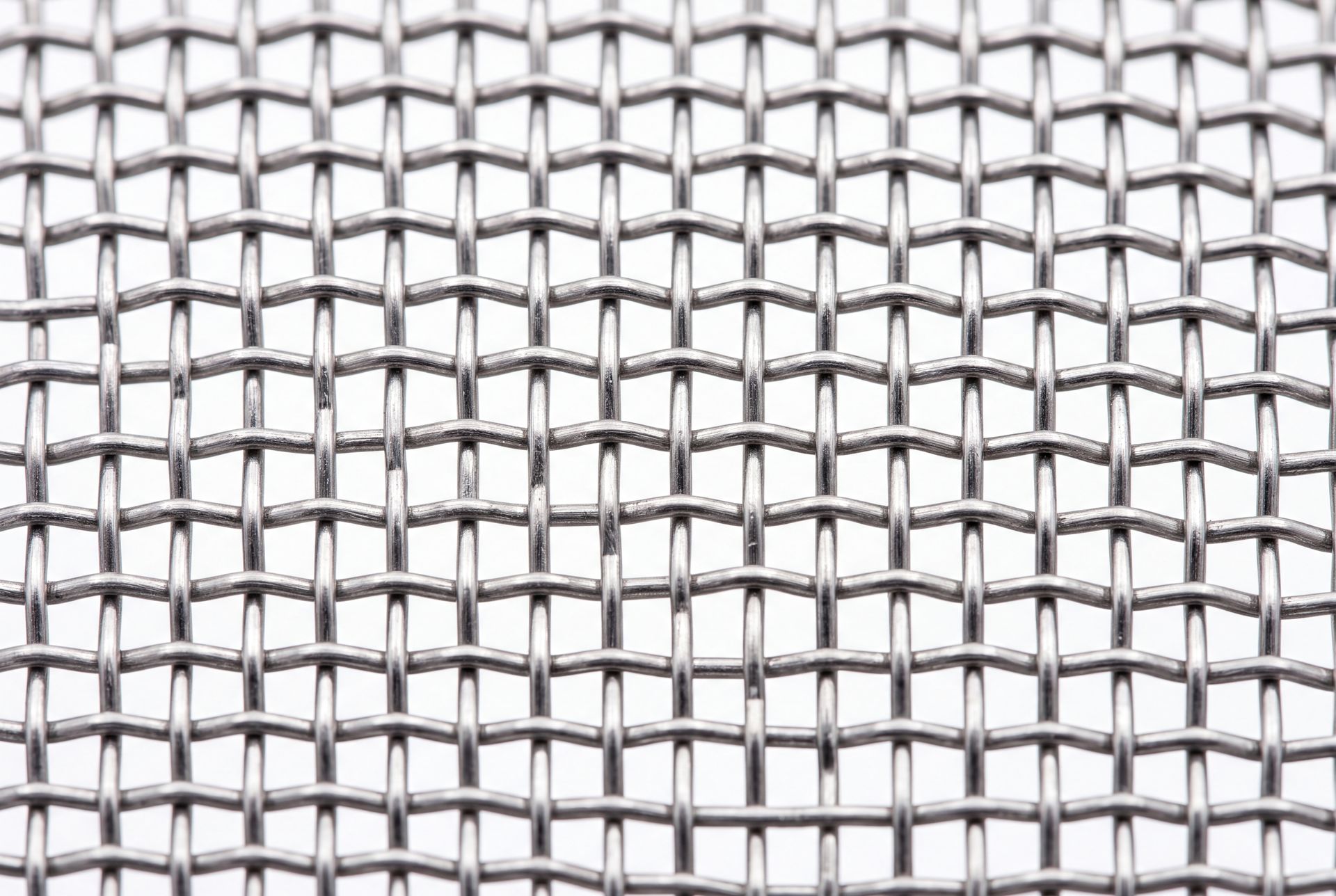 Close-up of a metal wire mesh screen with a repeating grid pattern