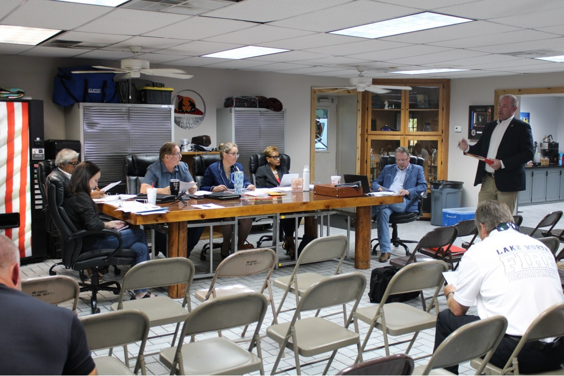 A man is giving a presentation to a group of people