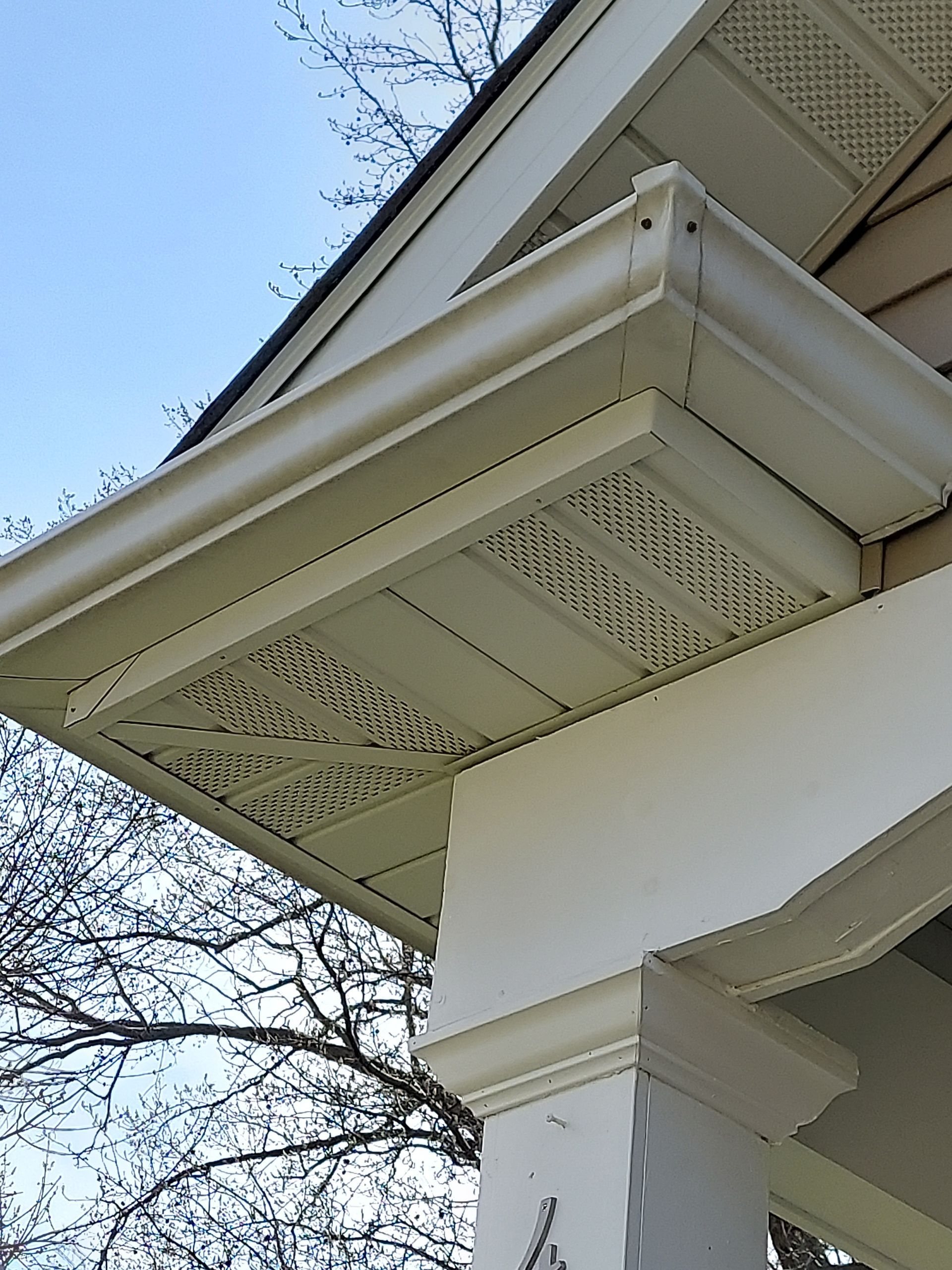 After gutter brightening in Belleville. SprytNa Exterior restoring stained gutters to bright white for better curb appeal.