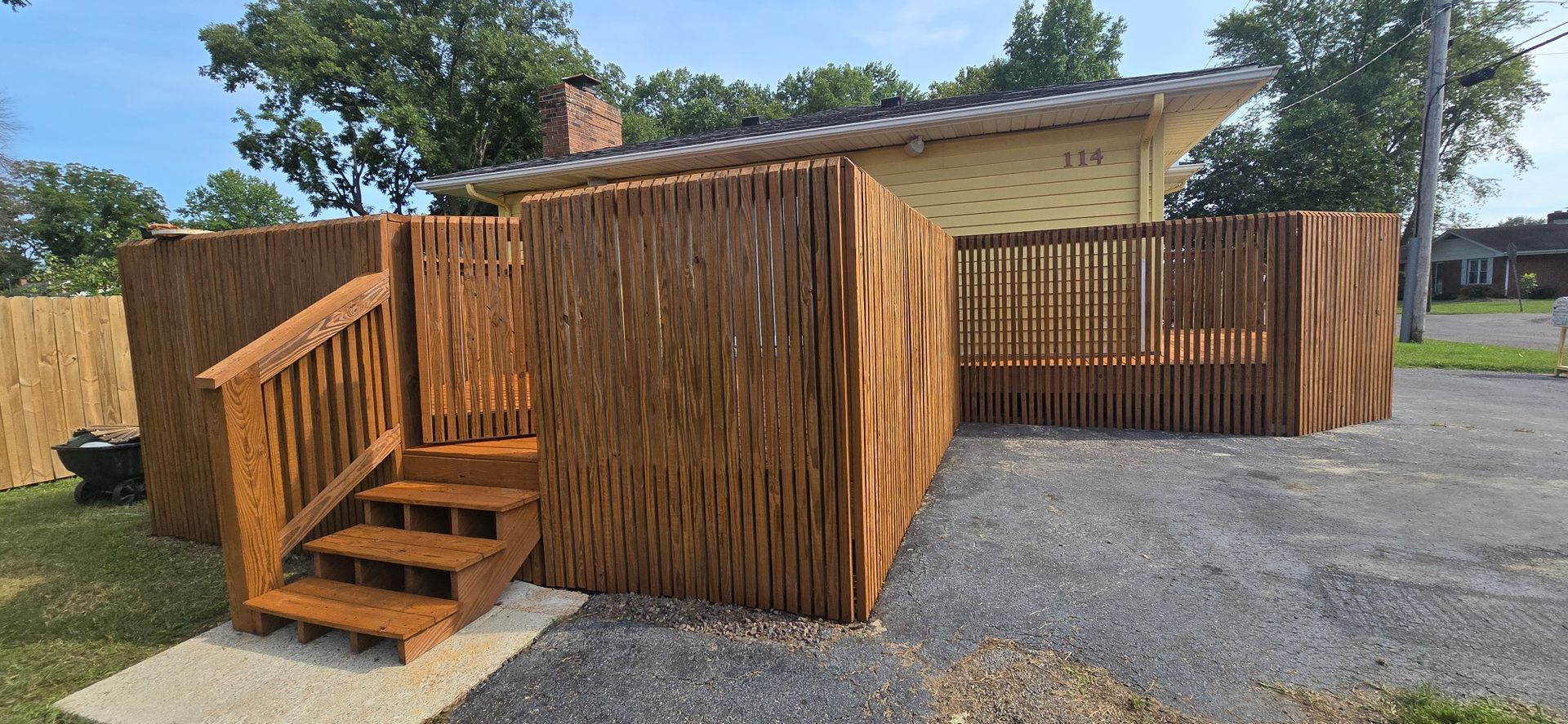 Deck and fence staining in Mascoutah, IL by SprytNa Exterior Cleaning using Stain and Seal Experts Auburn semi-solid.