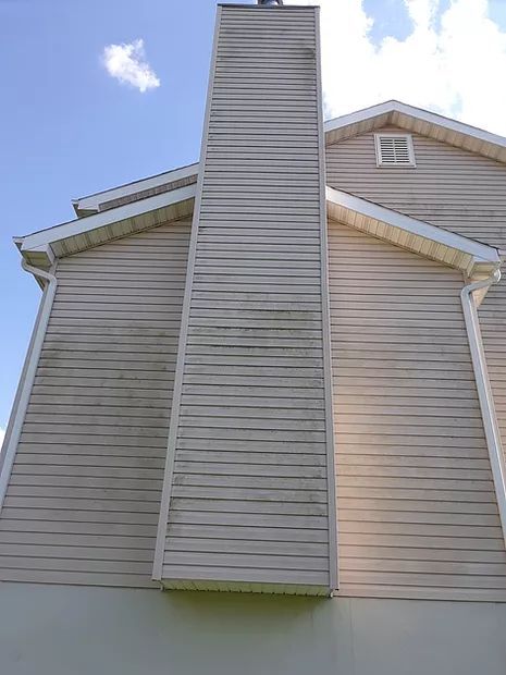 2-story house and chimney cleaning in Belleville, IL. SprytNa Exterior safely removing soot and algae from high surfaces.