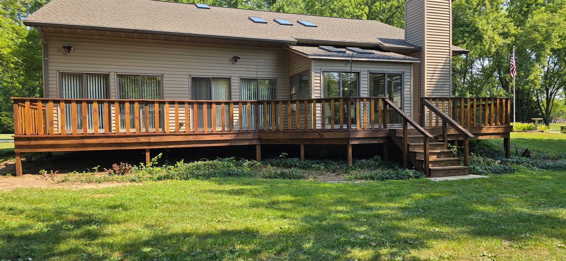 After deck repair and staining with Stain and Seal Experts Pecan Semi-transparent stain. Sprytna Exterior Cleaning.