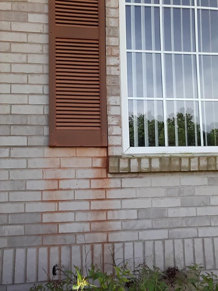 Paint Oxidation on a vinyl shutter and brick house