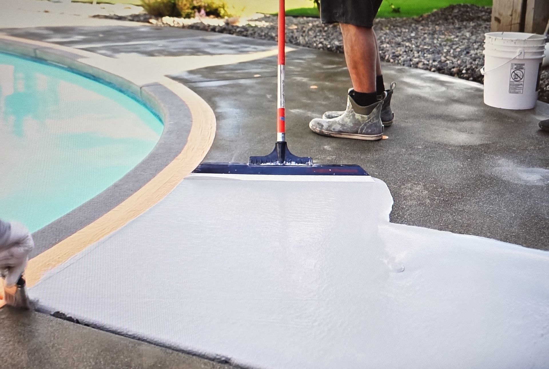 Professional concrete overlay application on a backyard pool deck by Sprytna Exterior Cleaning in Belleville, IL.