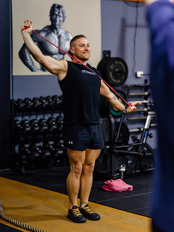 a man using a stretch band to work out