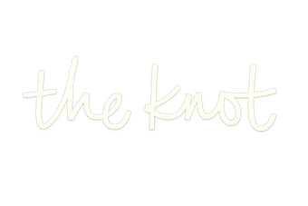 Cream cursive text reading “the knot” on a white background
