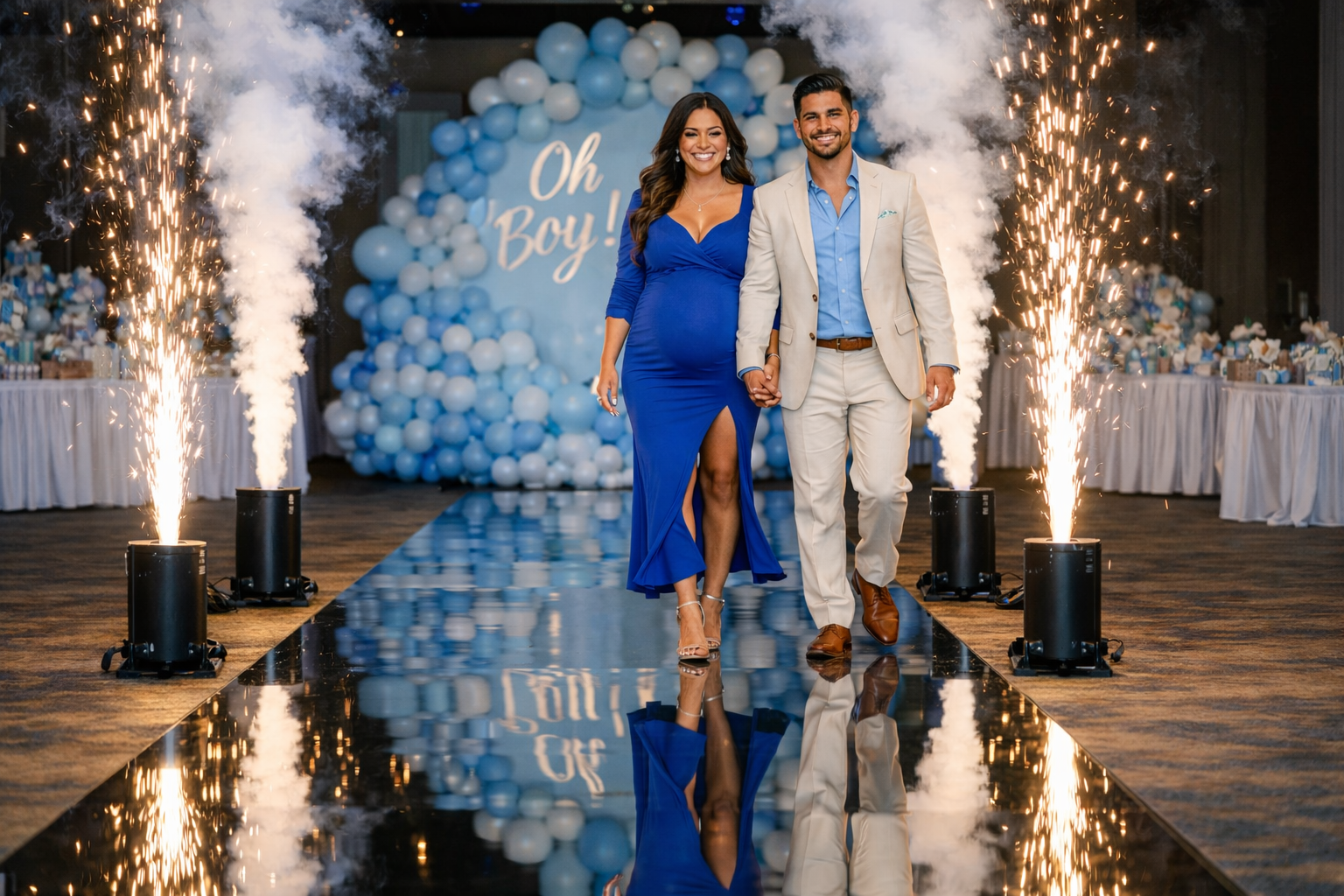 Couple walking down a reflective aisle at a blue balloon baby shower, flanked by sparklers and an “Oh Boy!” backdrop