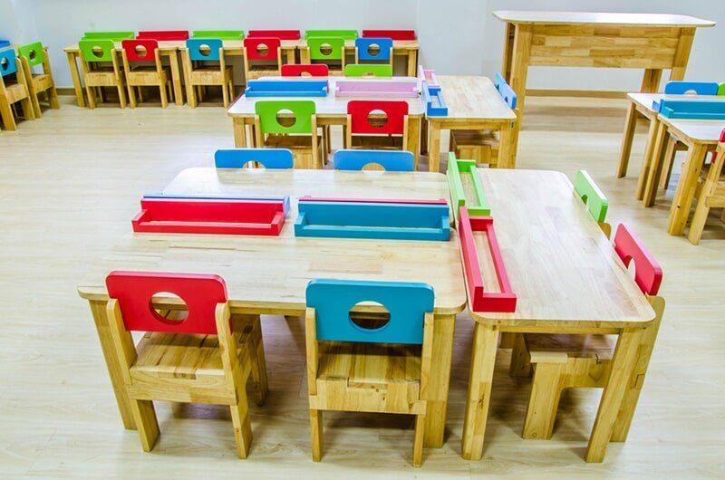 Class Room With Wood Desks — Child Care in Bowen, QLD