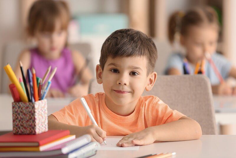 Boy Drawing in Classroom — Child Care in Bowen, QLD