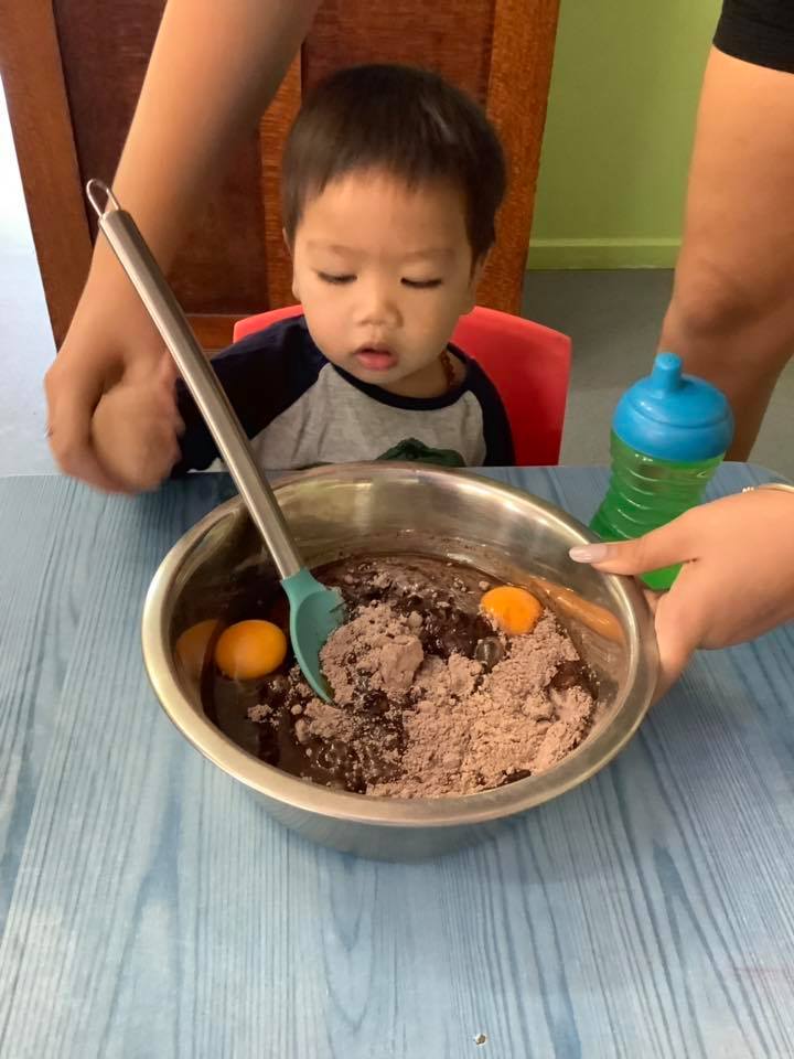 Boy Mixing Cake Mix — Child Care in Bowen, QLD