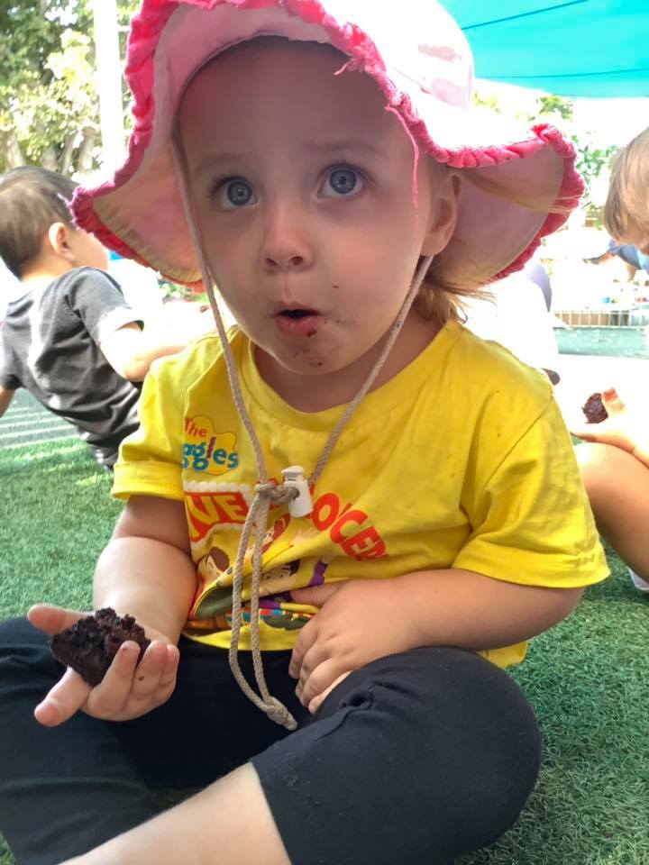Girl Eating — Child Care in Bowen, QLD