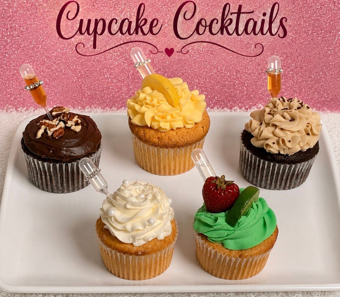 Pastel Easter dessert table with cupcakes, flowers, bunny decorations, and pink drinks