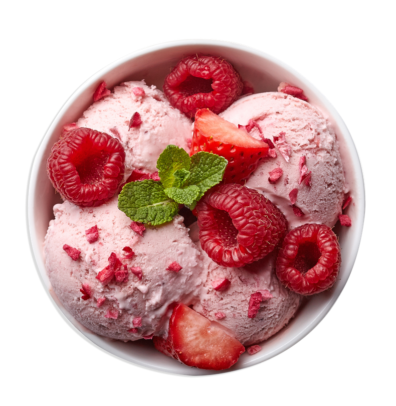 Bowl of pink strawberry ice cream topped with fresh raspberries, mint, and strawberry pieces