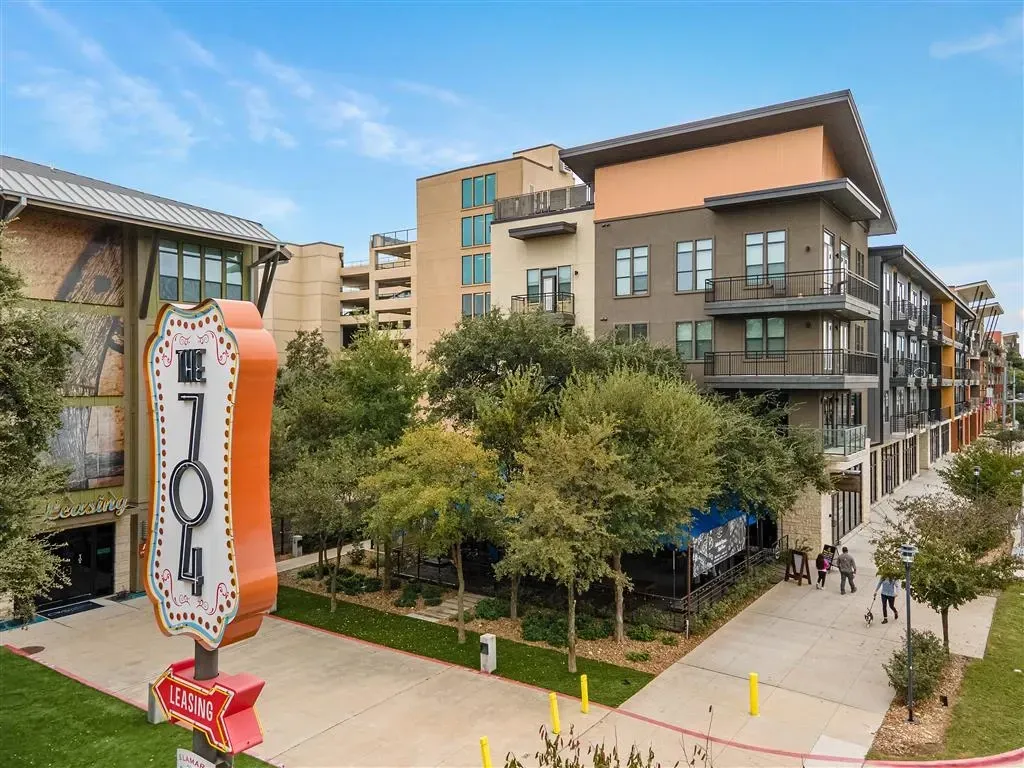 Exterior view of The 704 apartment building with a prominent 