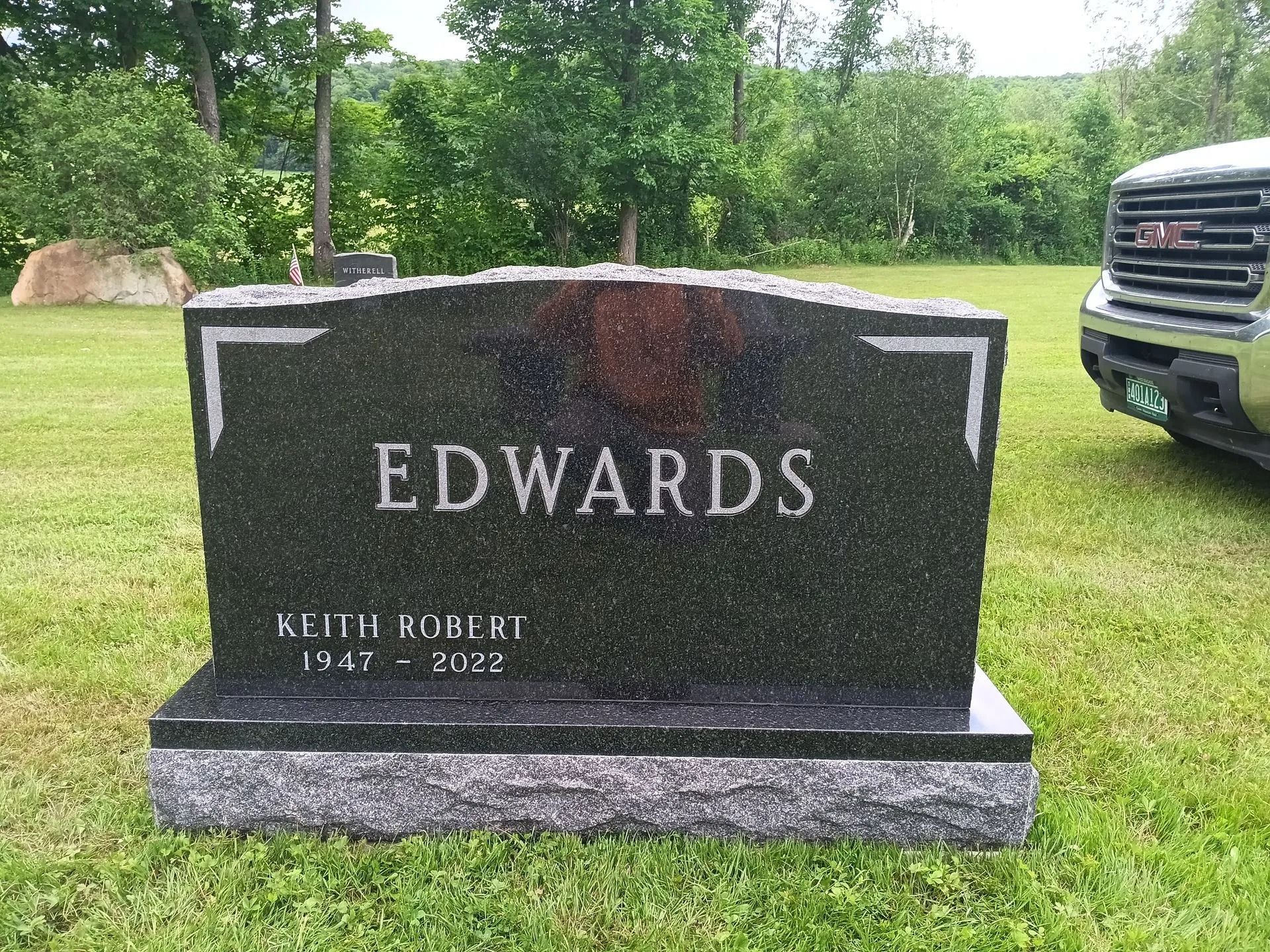 Black granite headstone with white lettering