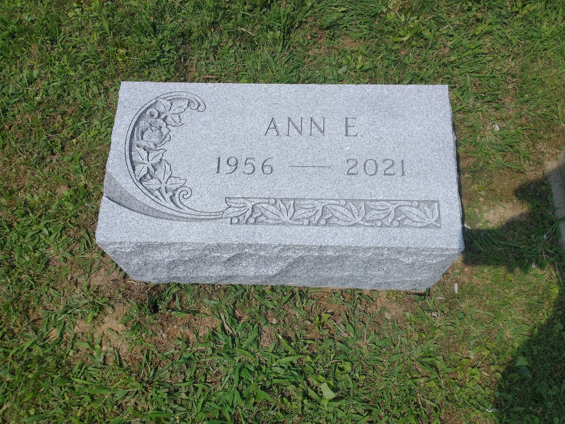 Gray granite headstone with