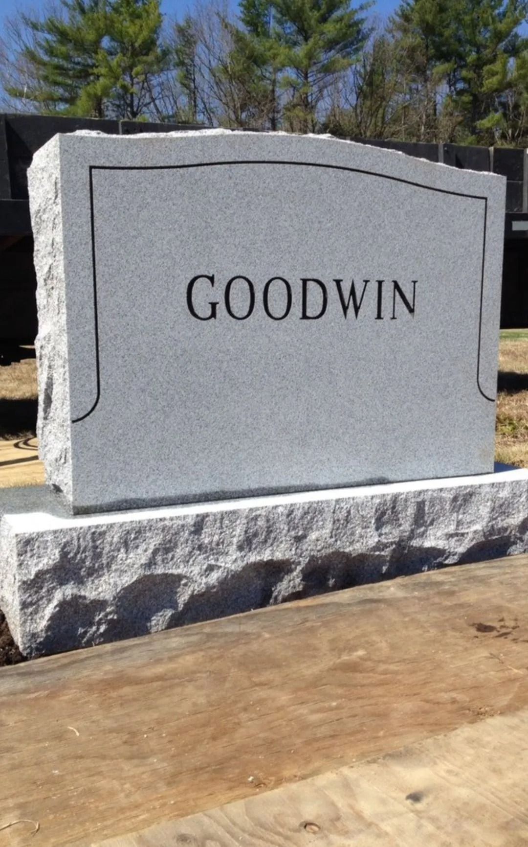 Gray granite headstone with