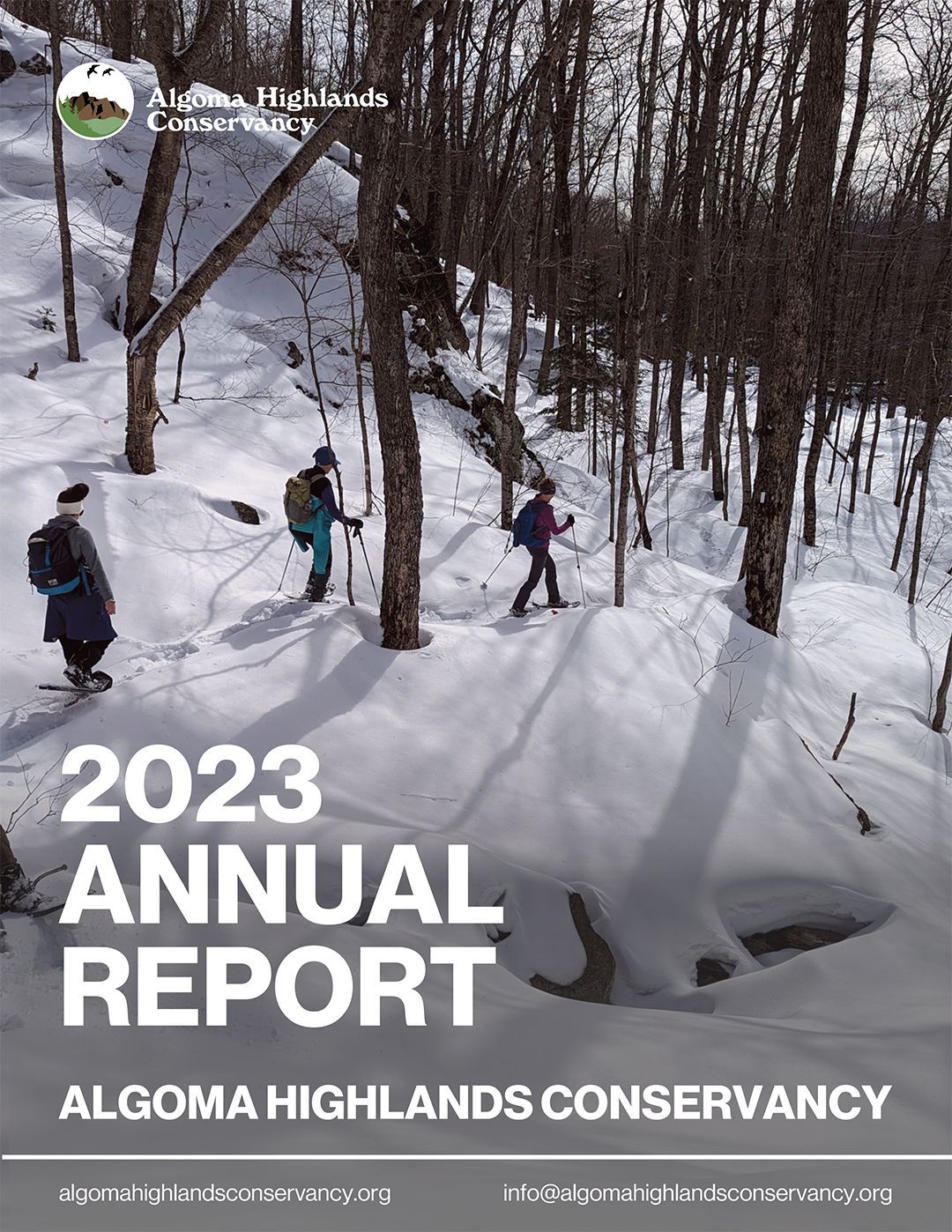 2023 Annual Report cover: hikers on a snowy forest trail for Algoma Highlands Conservancy