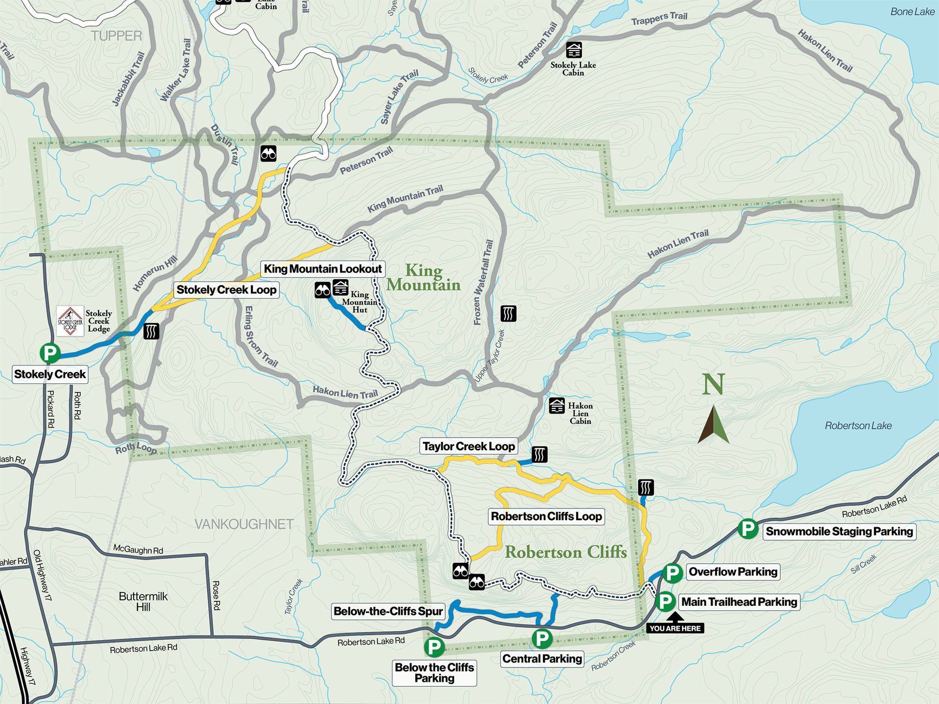 Download trail map Map with highlighted route lines, town labels, and a north arrow along a coastal area