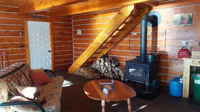Woodstove and living room area at Norm's Cabin