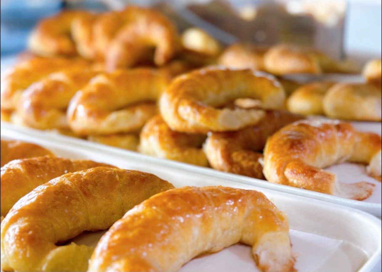 A bunch of croissants are sitting on a table