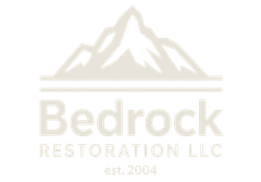 Company logo for Bedrock Restoration LLC, featuring a beige mountain illustration above the company name and est. 2004.