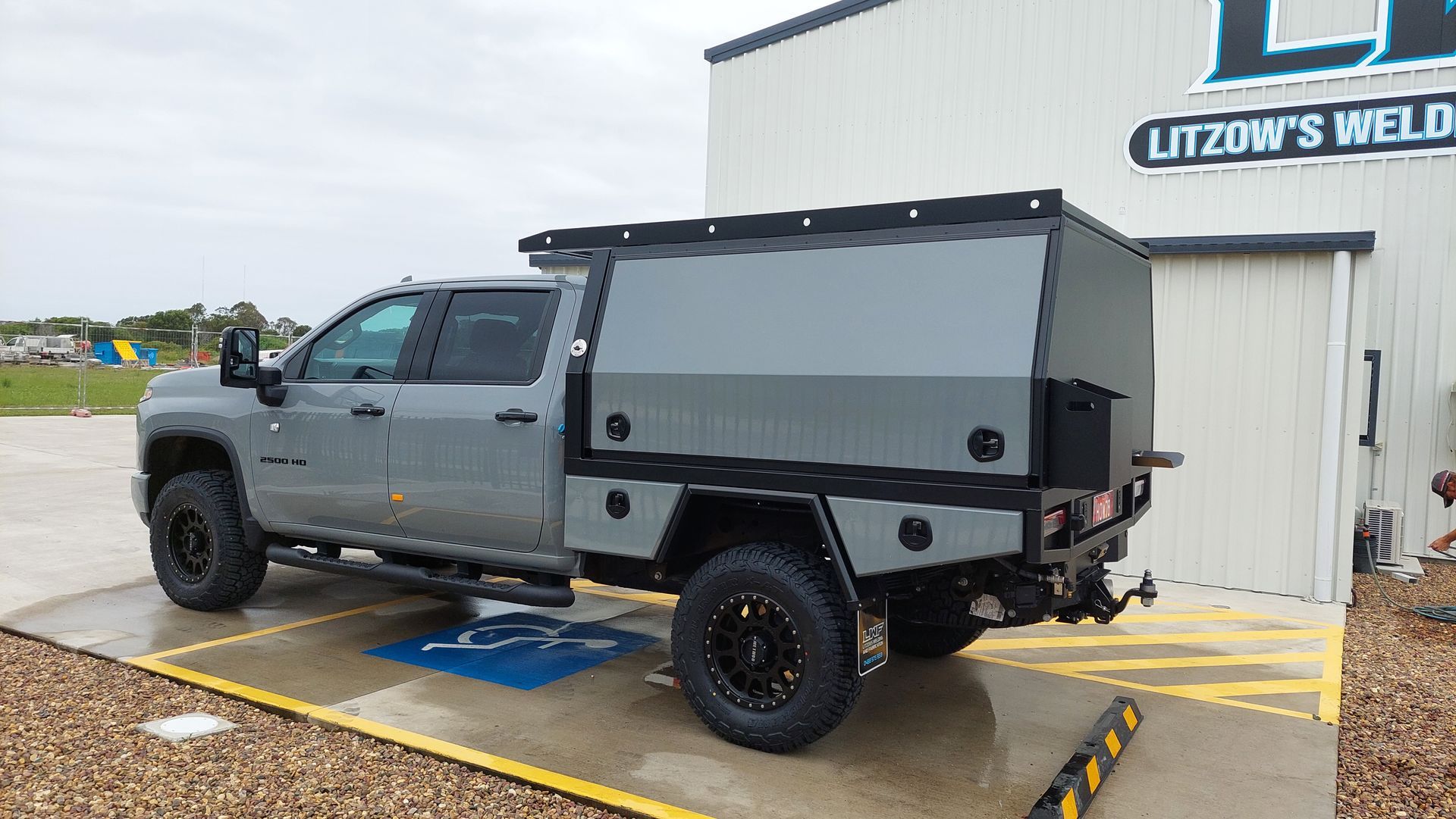 Gray Truck With Custom Utility Bed Parked Outside — Litzow’s Welding & Fabrication in Dundowran, QLD