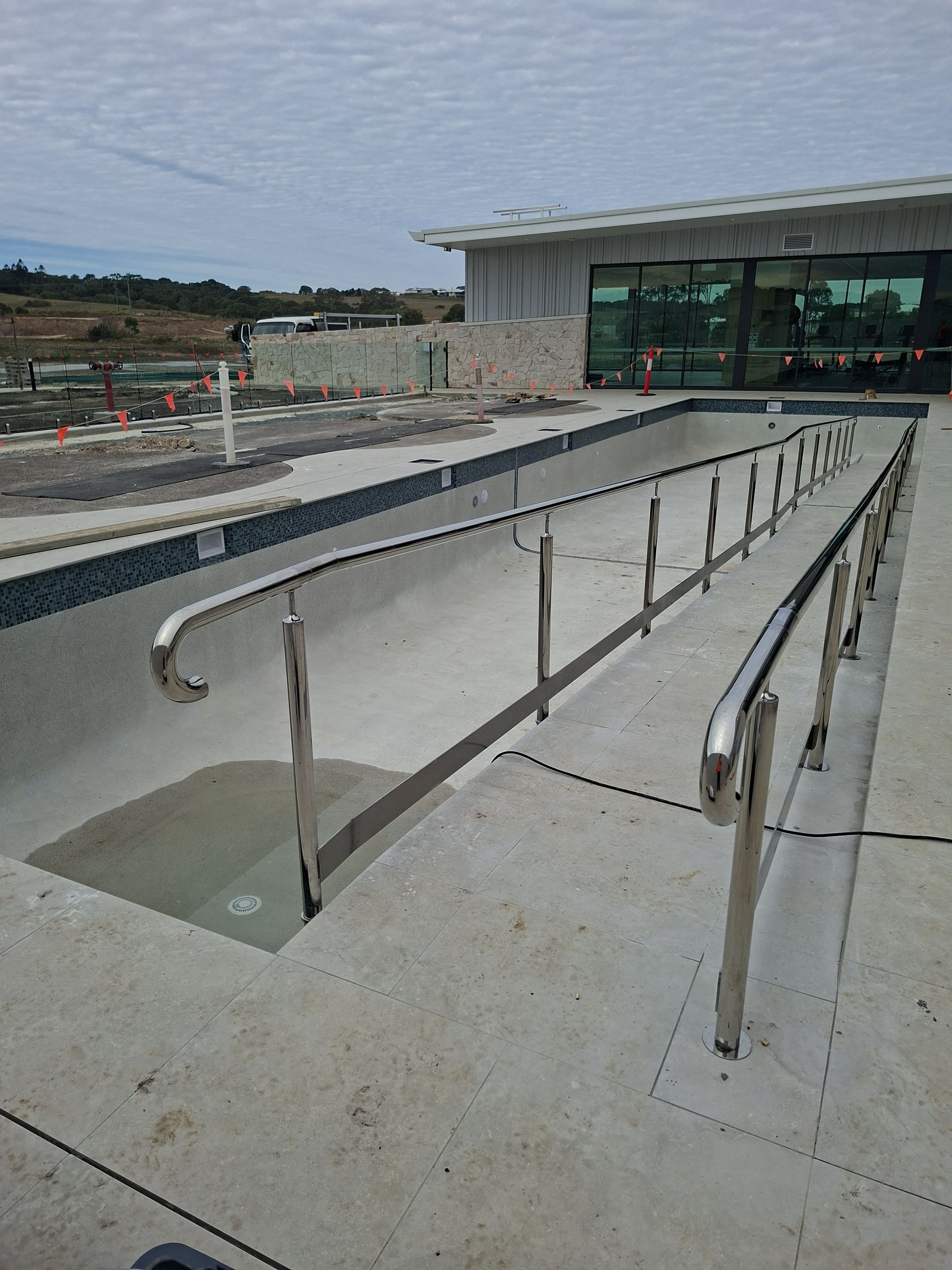 Empty Swimming Pool With Installed Stainless Steel — Litzow’s Welding & Fabrication in Dundowran, QLD