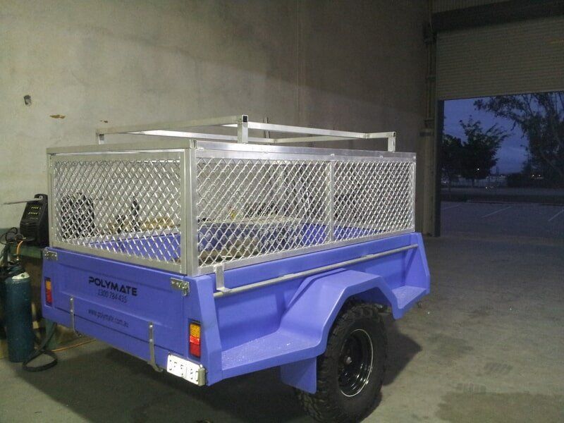 Blue Utility Trailer With Metal Cage — Litzow’s Welding & Fabrication in Dundowran, QLD