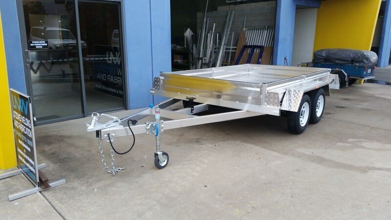 Silver Utility Trailer With White Wheels — Litzow’s Welding & Fabrication in Dundowran, QLD