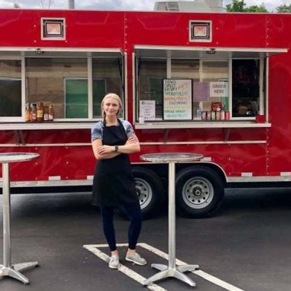 Dana in front of food truck.