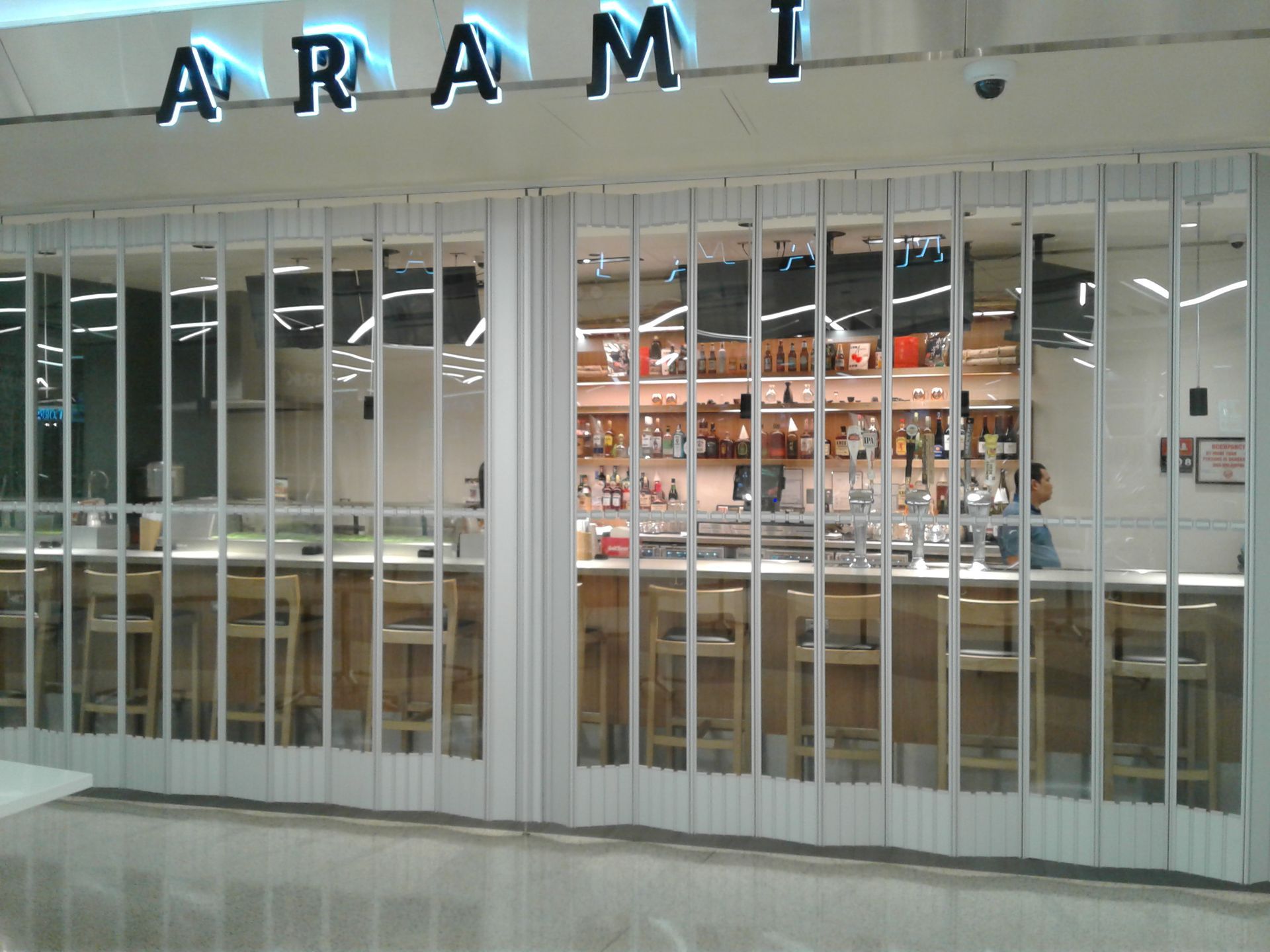 A restaurant called arami has a bar inside of it