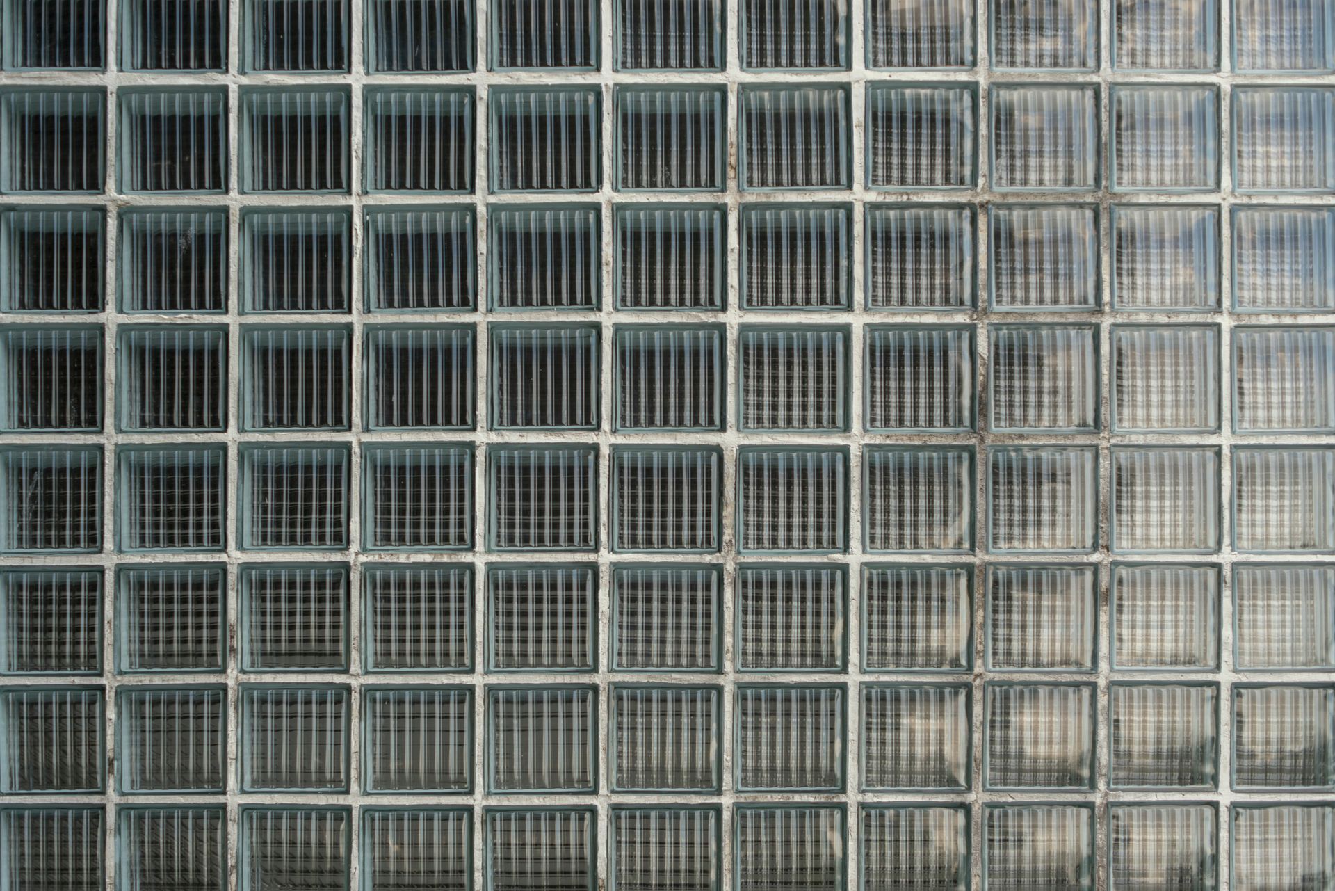 Grid of frosted glass blocks forming a geometric wall pattern