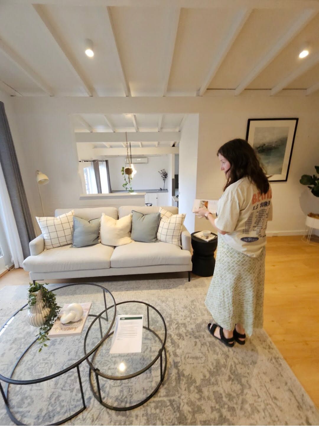 Woman Standing in A Bright Living Room — Brightside Buyers Agency in Dundas, NSW