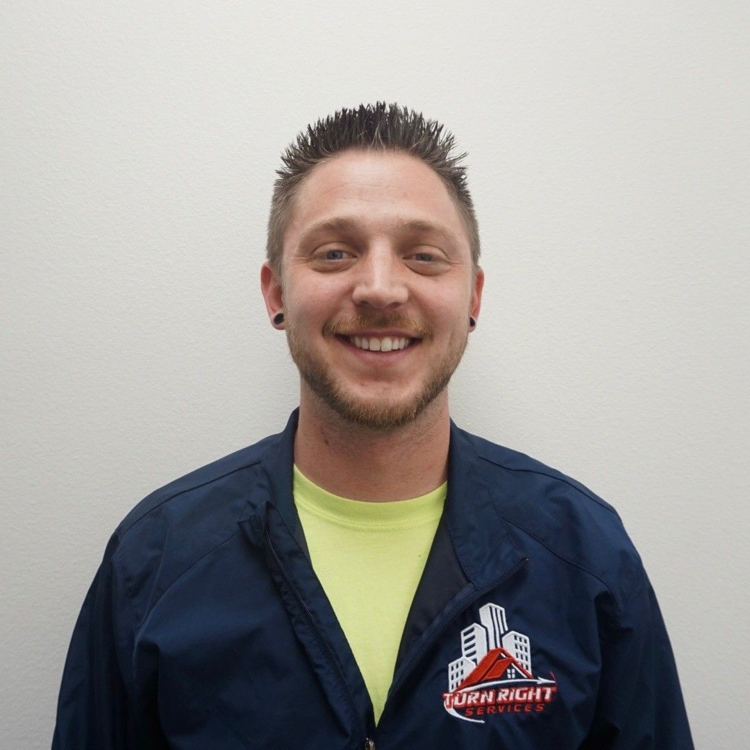 Matt, the owner of Bulldog Heating and Air, wearing a blue polo shirt with