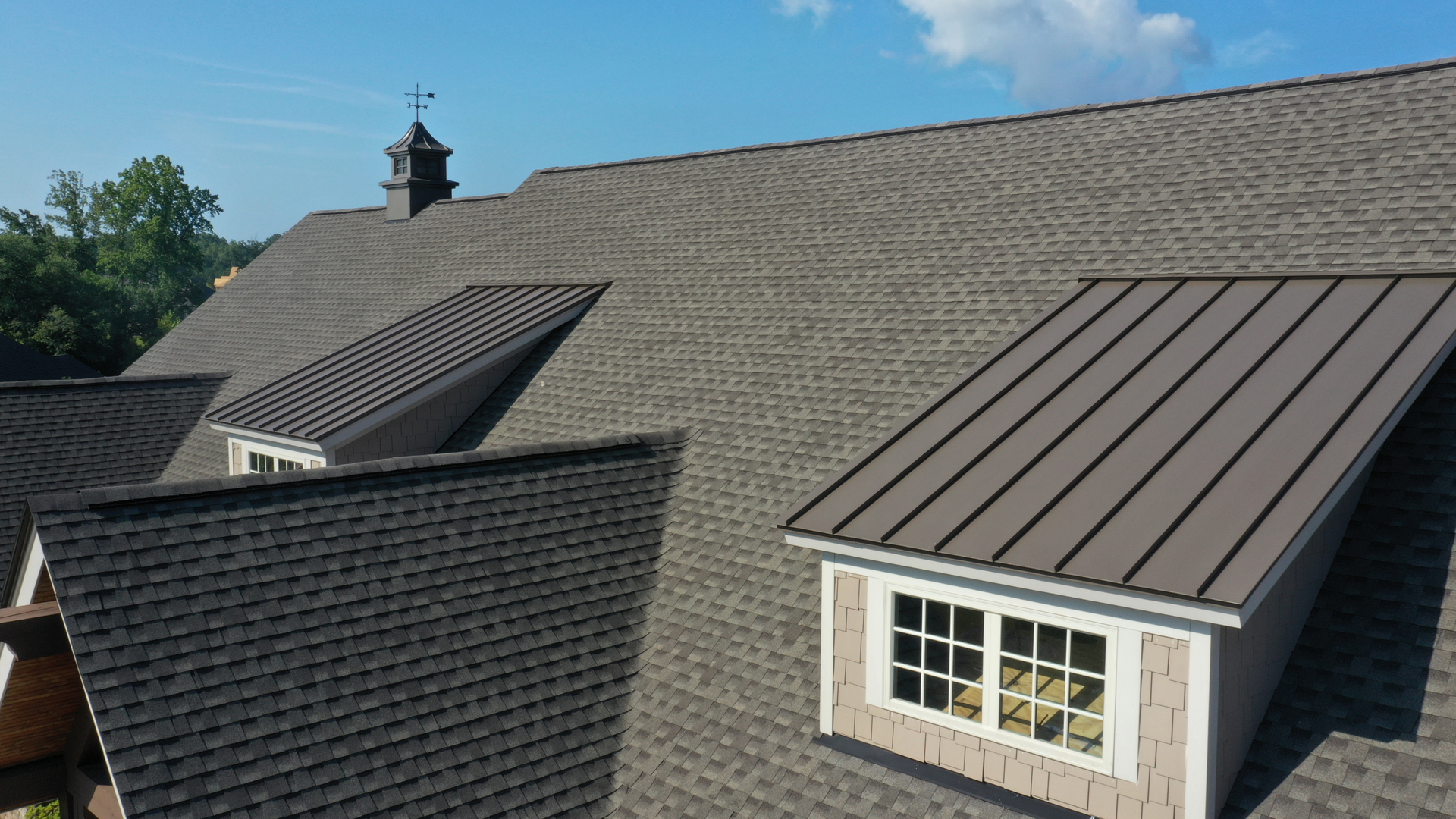 An aerial view of a house with a roof and a window.