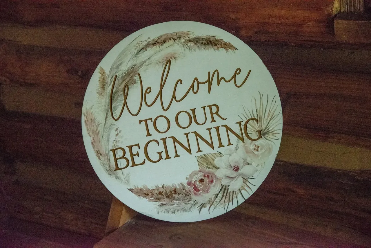 A circular wedding sign reads 