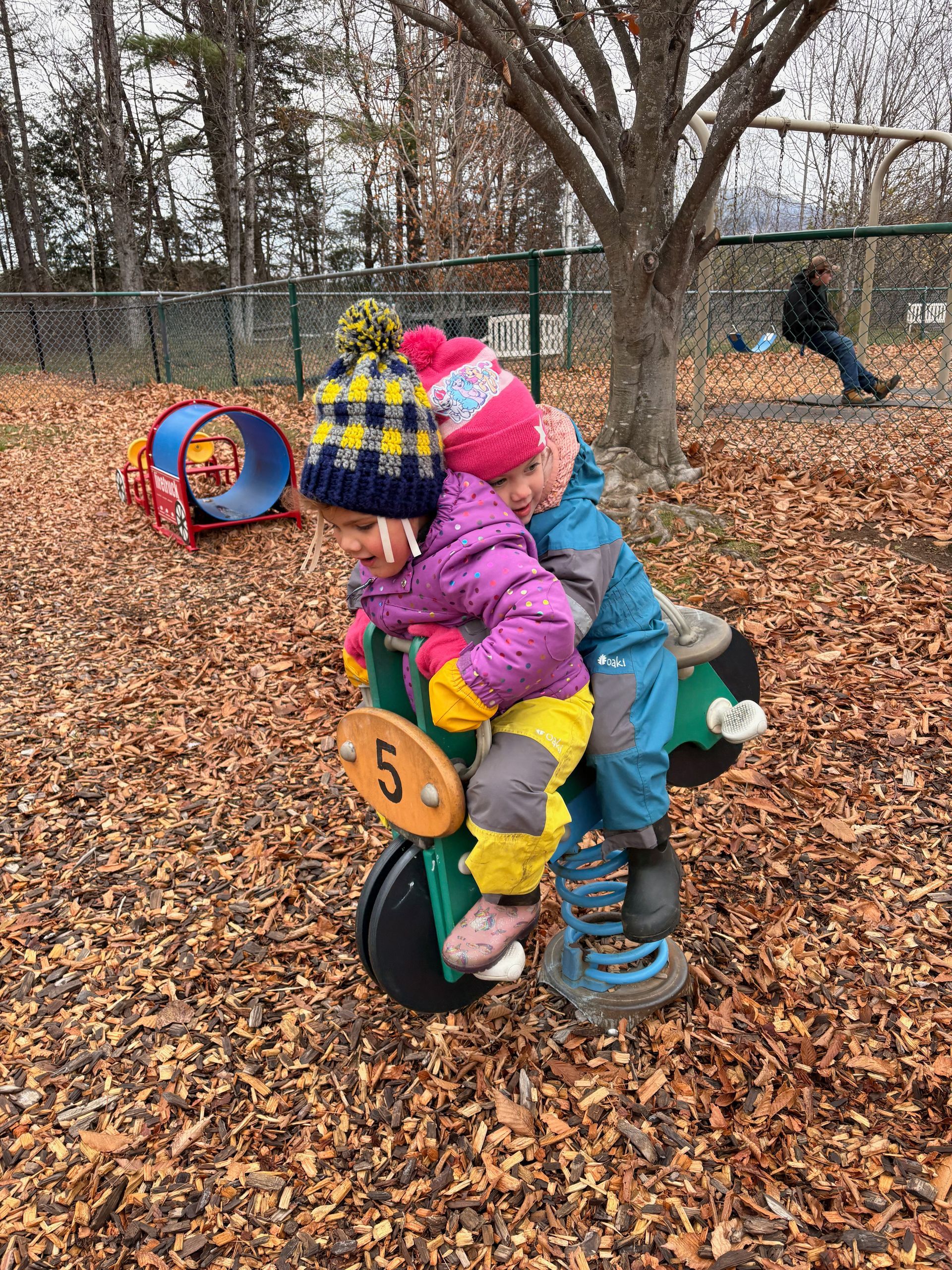 two preschool aged boys playing outside