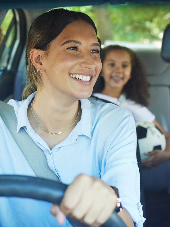 mother driving her child to soccer practice