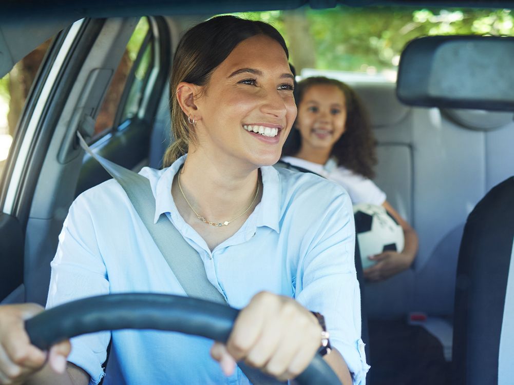 mother driving her daughter to somewhere