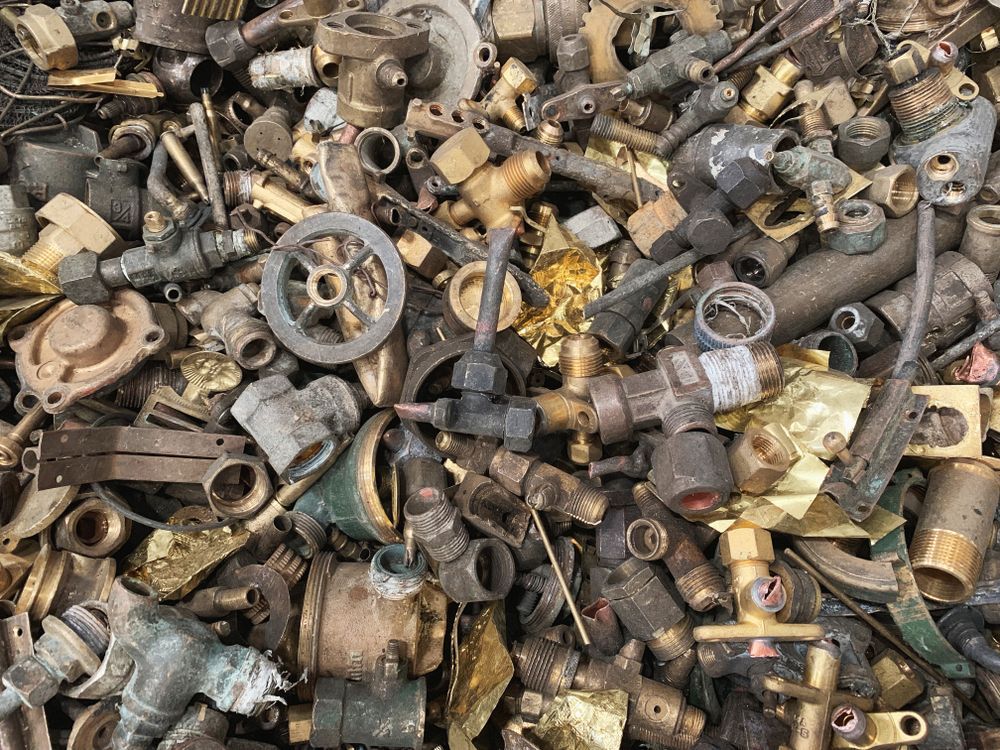 Pile of Mixed Scrap Metal, Including Brass Fittings and Pipes — Independent Scrap Metal Pty Ltd in Byron Bay, NSW