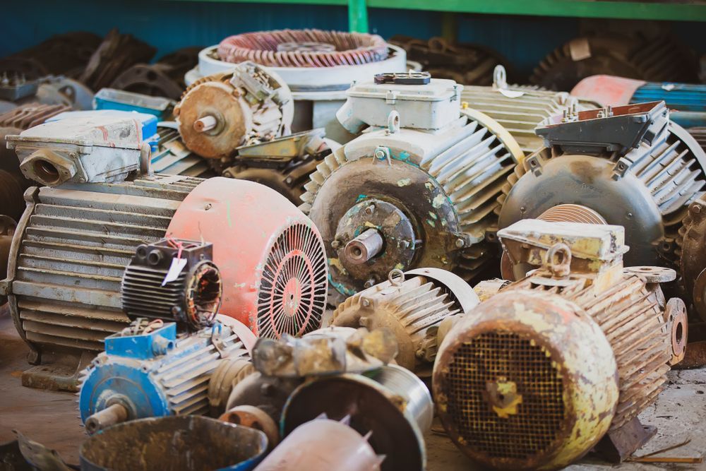 A Pile of Old, Used Electric Motors in Varying Colors — Independent Scrap Metal Pty Ltd in Casino, NSW