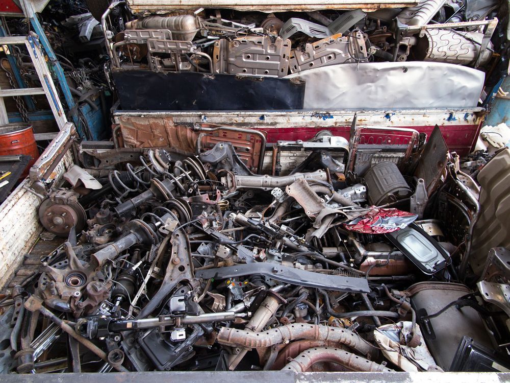 Jumbled Pile of Auto Parts in a Cluttered Workshop or Junkyard — Independent Scrap Metal Pty Ltd in Ballina, NSW
