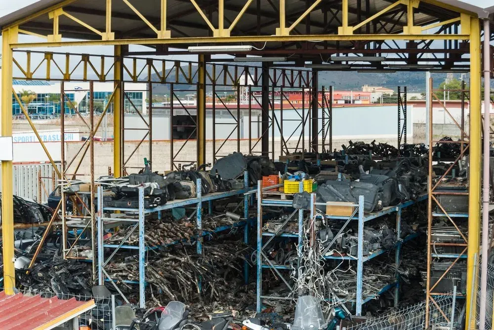 Shelves of Scrap Parts Under a Yellow-framed Shelter — Independent Scrap Metal Pty Ltd in Murwillumbah, NSW